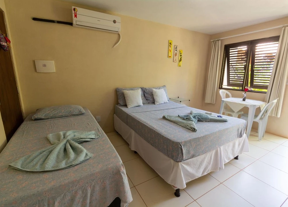 Estúdio com cama de casal e cama de solteiro